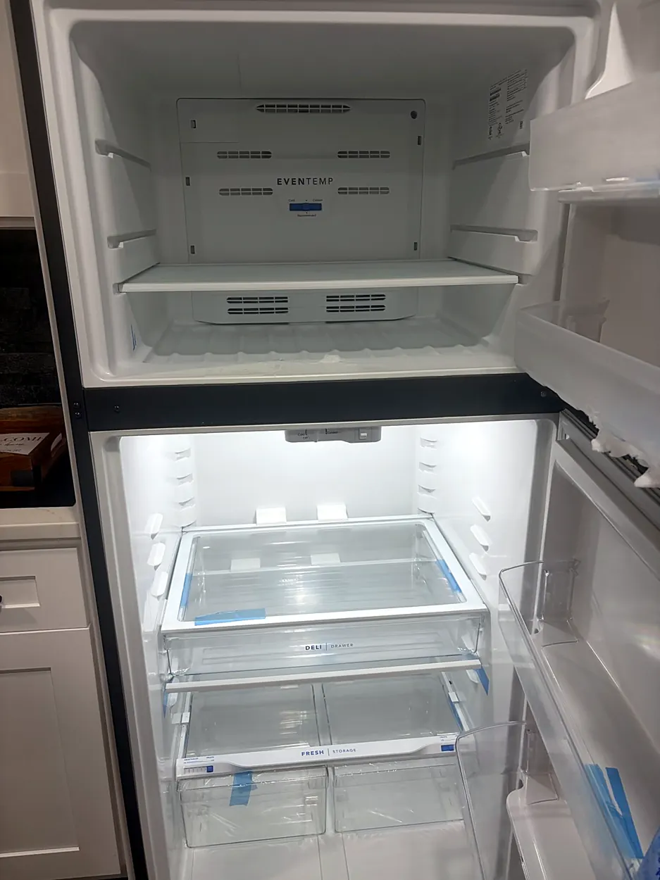 Refrigerator (clean empty shelves) after an Airbnb turnover in Bayonne, NJ