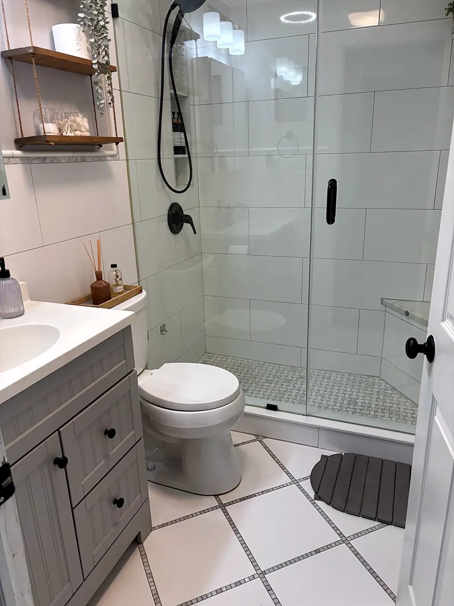 Bathroom (glass shower, gray vanity) after a cleaning in Hoboken, NJ
