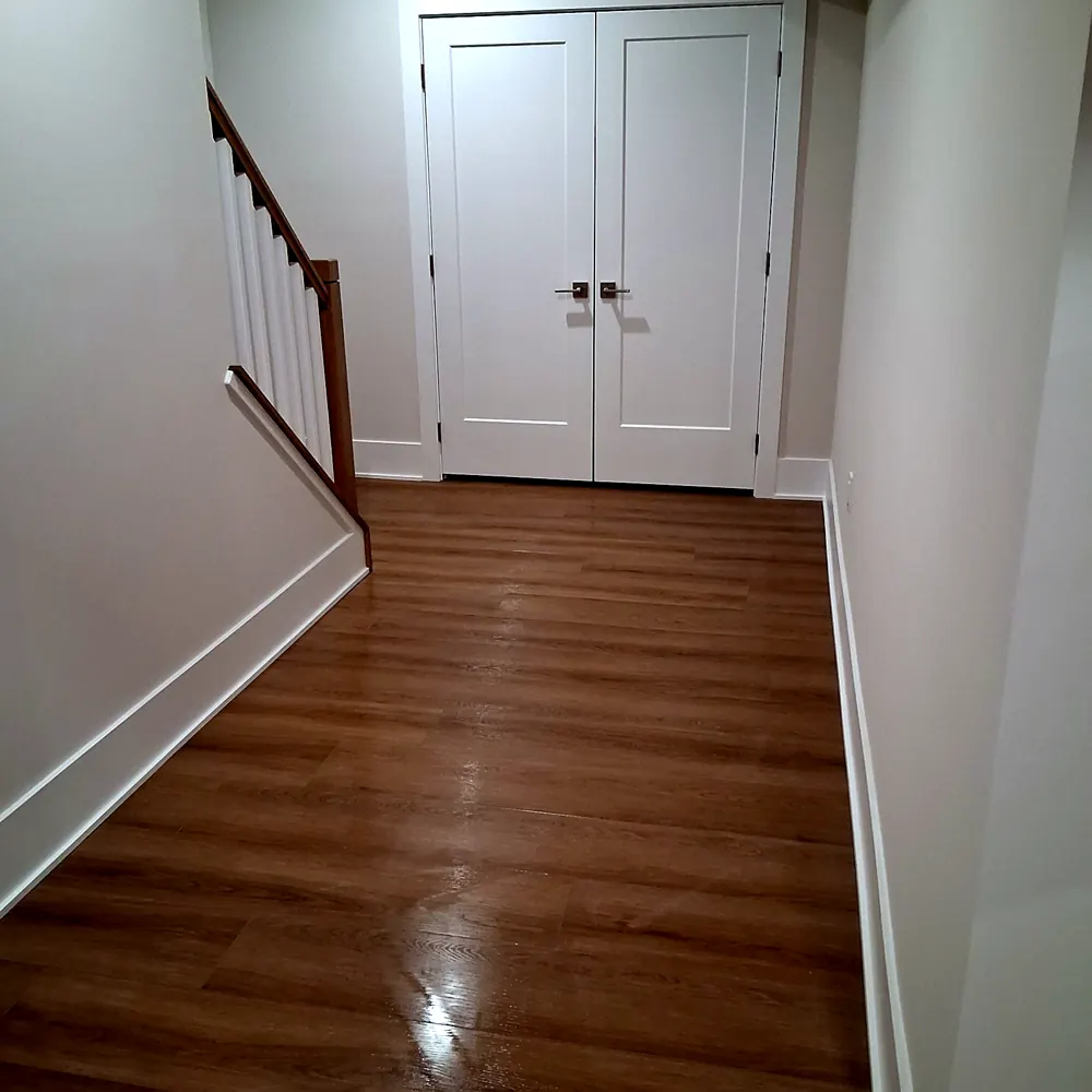 Hallway (oak stairs, double doors) after a home cleaning in River Vale, NJ