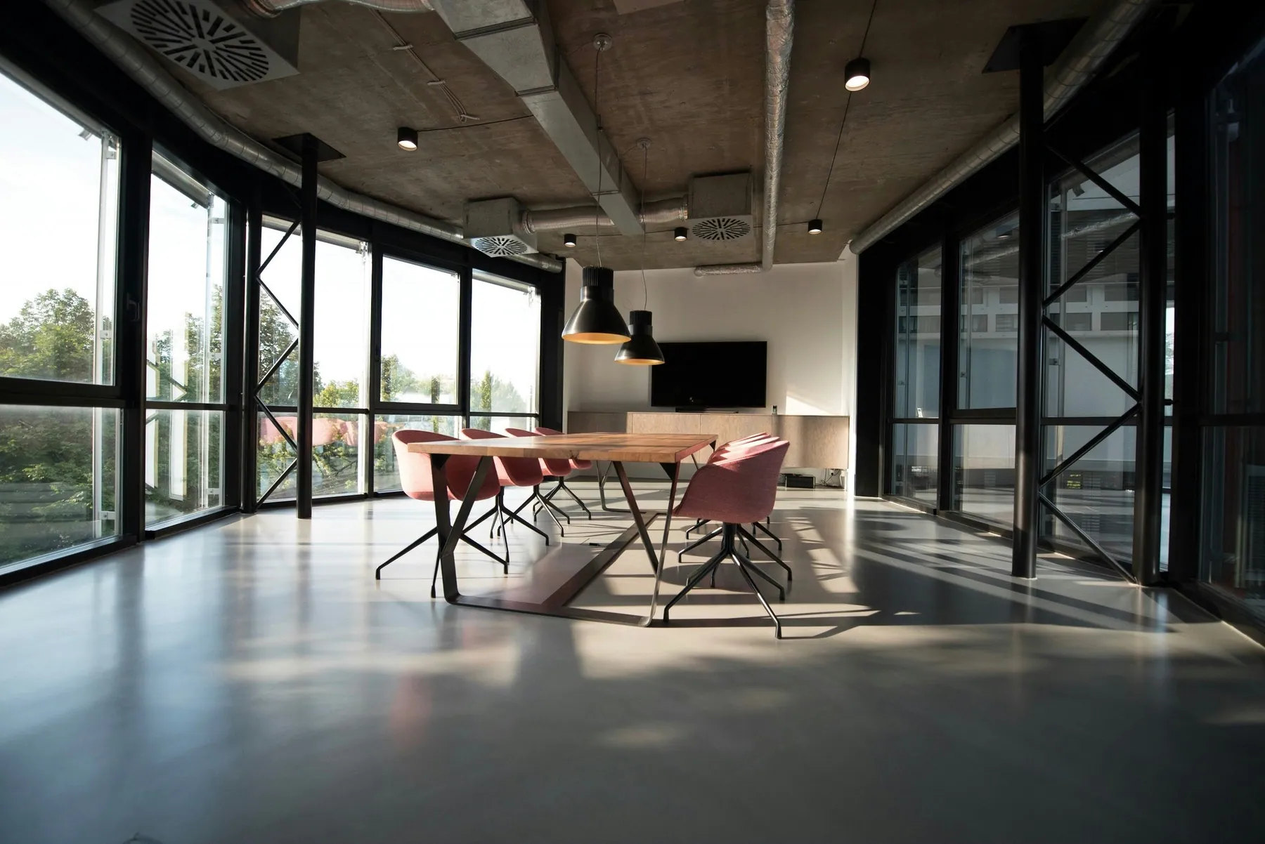 Office conference room with glass walls and a long table