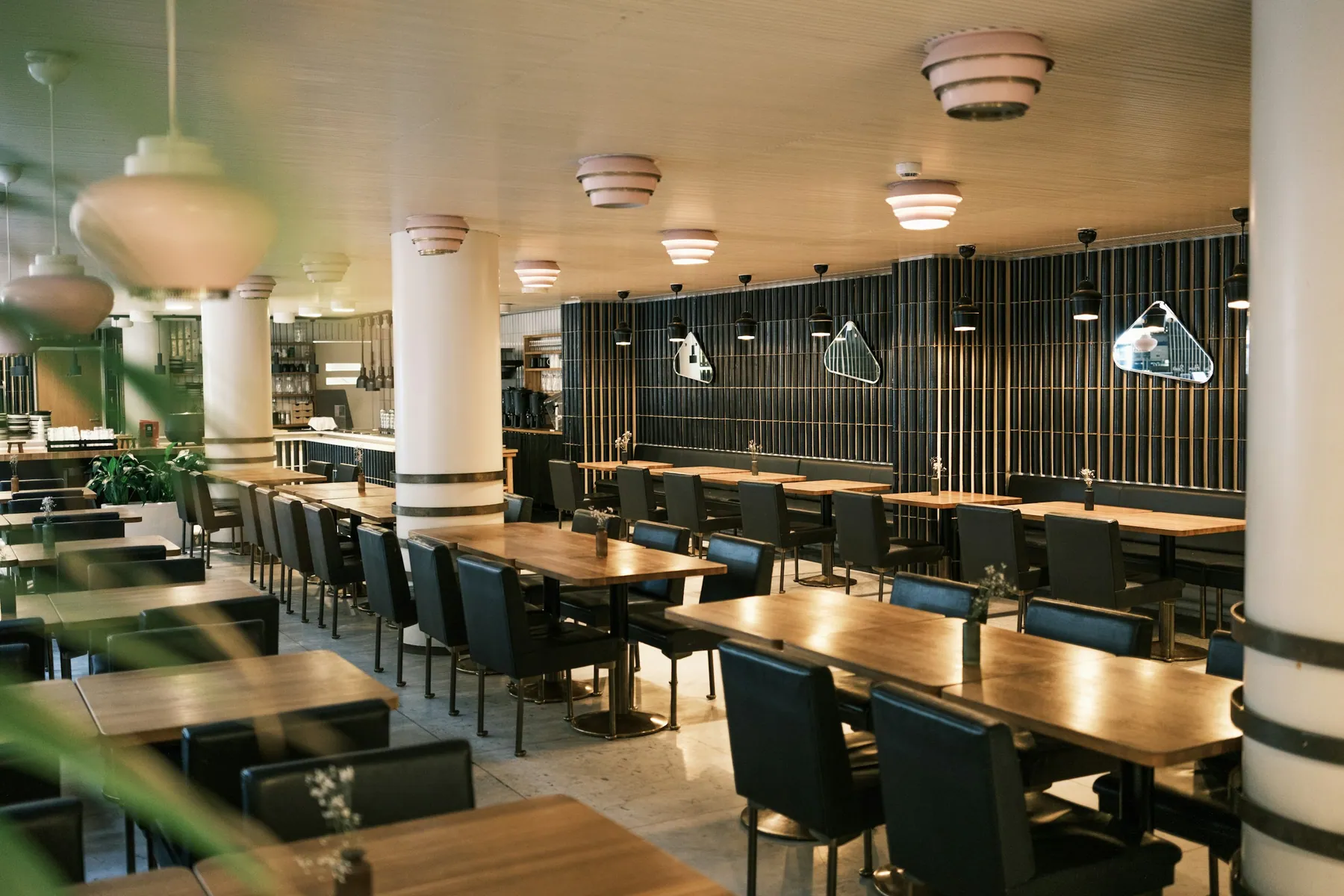 Modern restaurant dining room set for service
