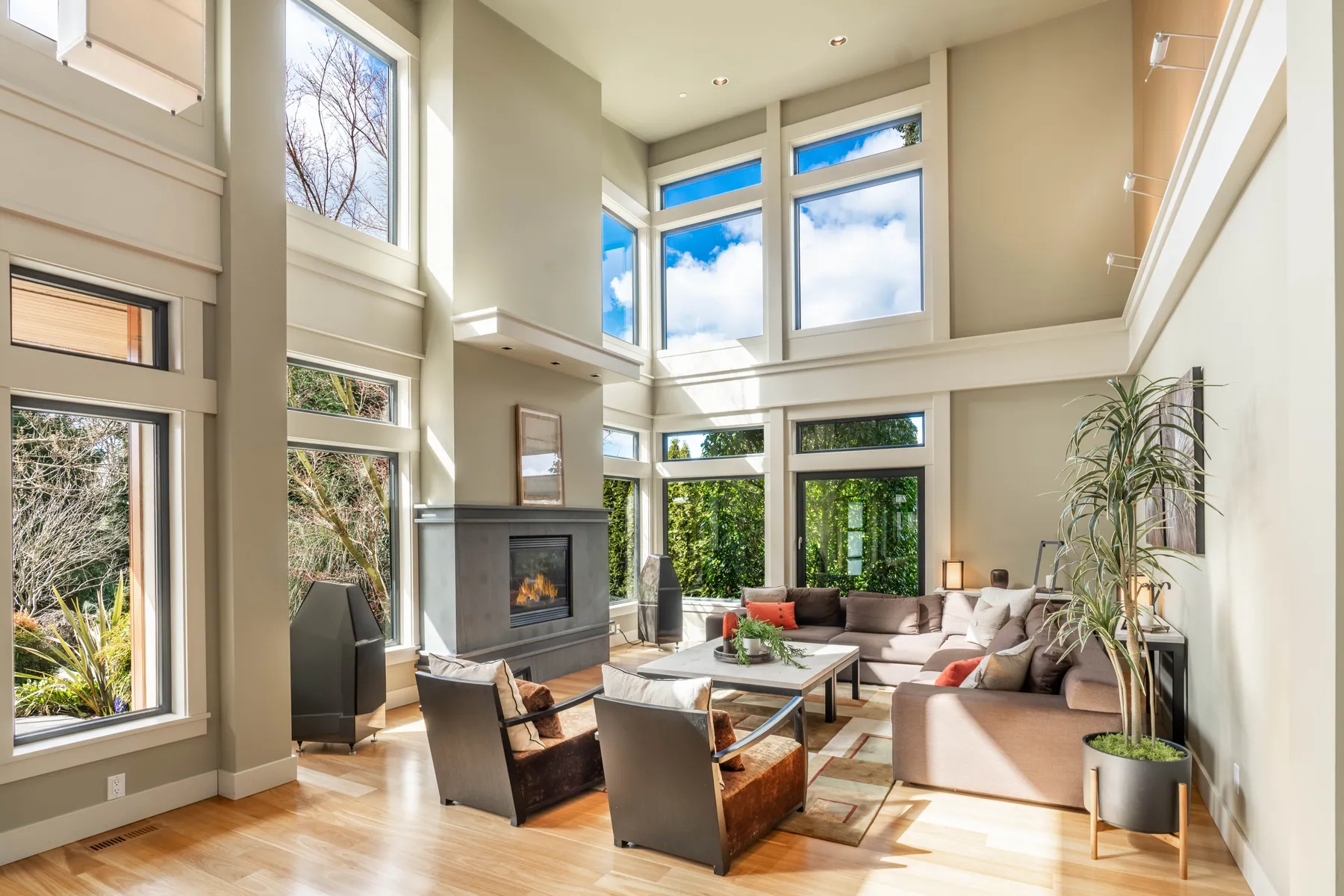 Two-story great room with walls of windows